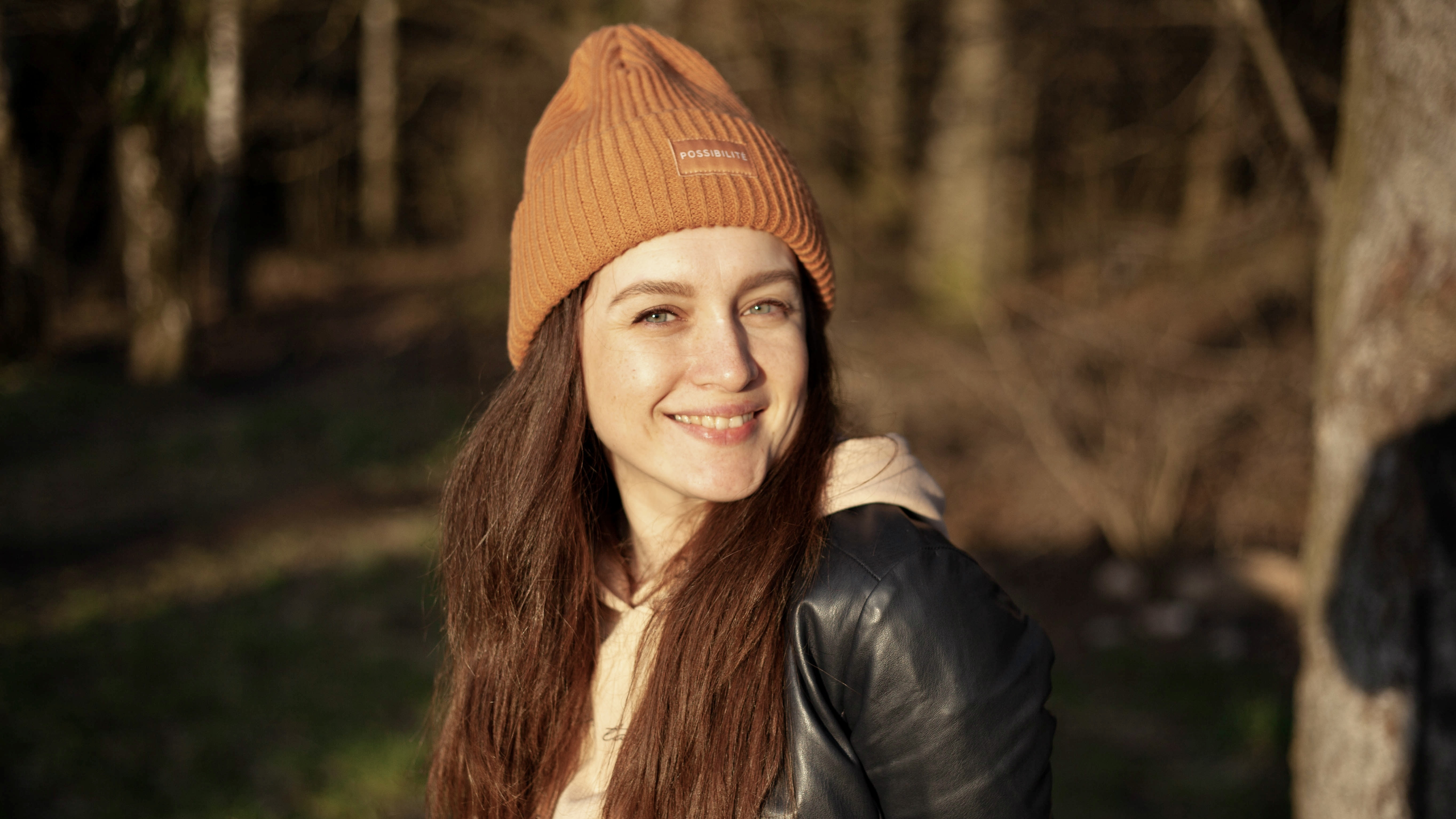 smiling woman portrait standing outdoors